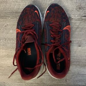 Nike Men’s Red Athletic Running Shoes with Orange Swoosh